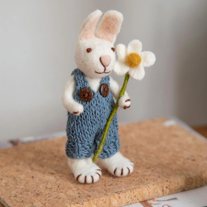 Gingerbread World European Easter Market - White Bunny with Blue Pants and Marguerite - on book