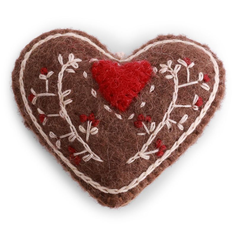 Handmade felted wool gingerbread heart ornament with cream and red embroidered details and a red heart, designed in Denmark and handmade in Nepal.
