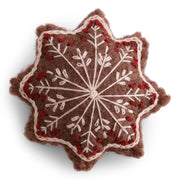 Handmade felted wool gingerbread star ornament with cream and red embroidered snowflake details, designed in Denmark and handmade in Nepal.