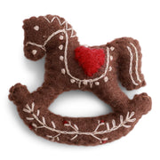 Handmade felted wool gingerbread rocking horse ornament with cream and red embroidered details and a red heart saddle, designed in Denmark and handmade in Nepal.