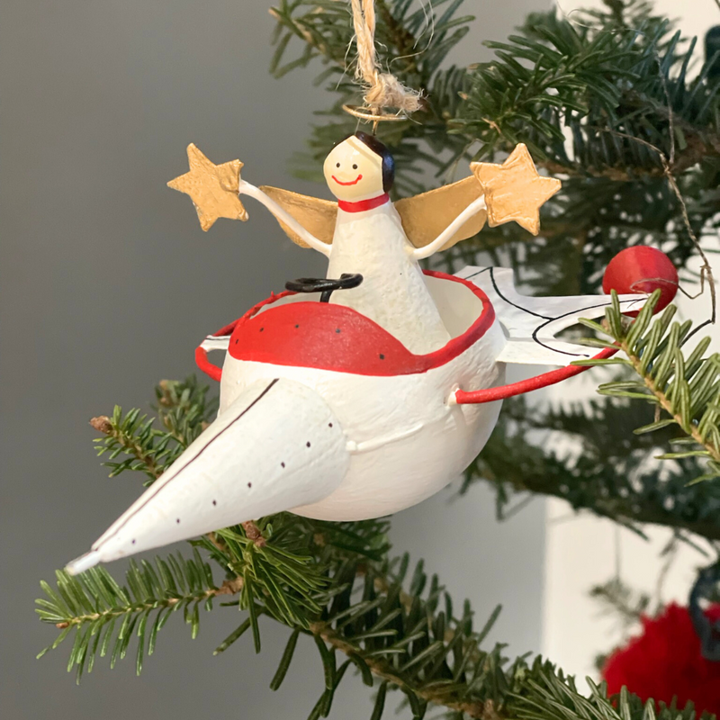 Handmade tin Angel in Rocket Ship Christmas ornament, designed in Denmark and handcrafted in the Philippines.