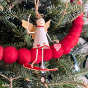 Handmade tin Angel on Skateboard Christmas ornament, designed in Denmark and handcrafted in the Philippines.