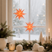 Gingerbread World Herrnhuter Sterne Canada - Herrnhuter Moravian Advent Star Lantern - 2026 Star of the year Apricot - displayed hanging in window