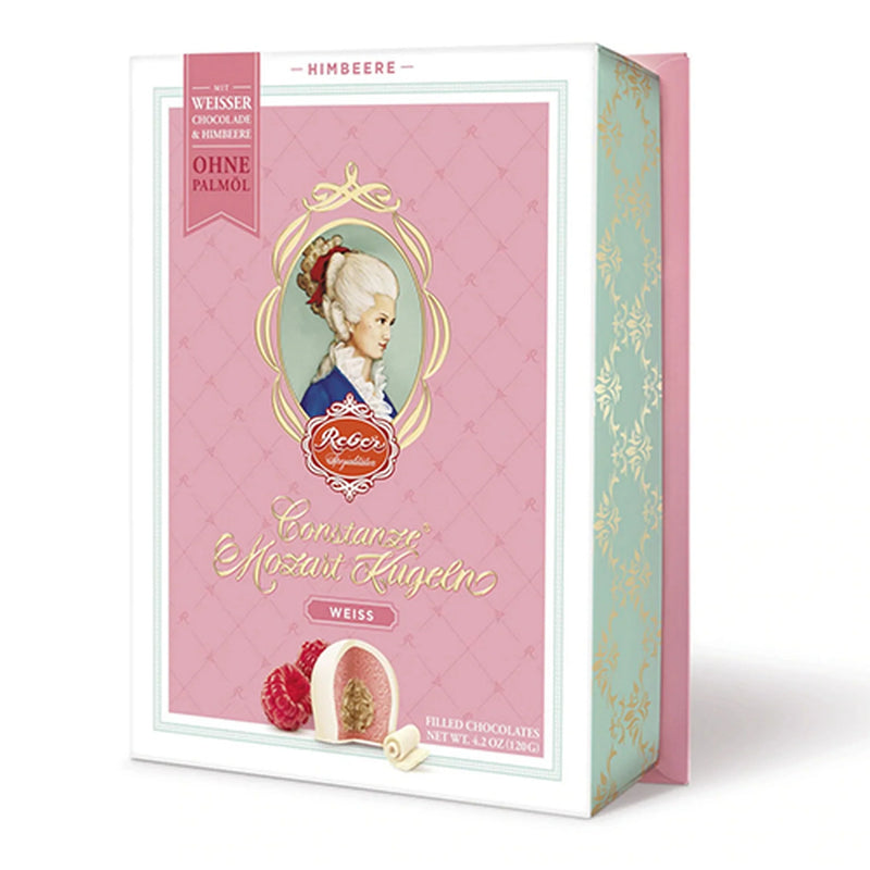 Reber Weiße Constanze® Mozart-Kugeln gift box with six raspberry marzipan pralines coated in white chocolate.