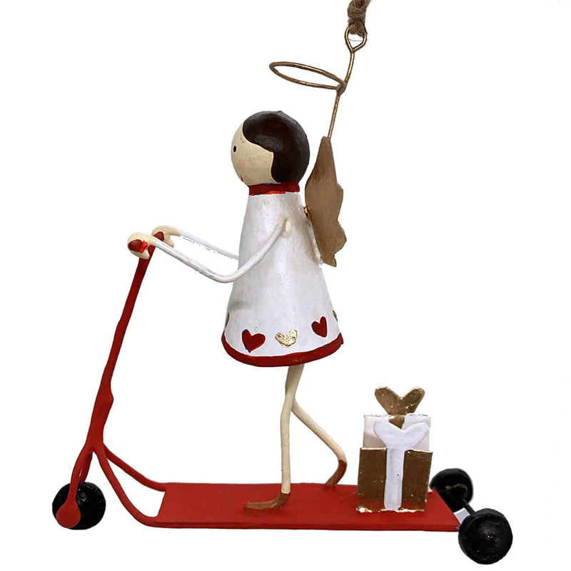 Handmade tin Angel on Scooter Christmas ornament with a wrapped gift, designed in Denmark and handcrafted in the Philippines.