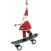 Handmade tin Santa on Skateboard Christmas ornament with a sack of gifts, designed in Denmark and handcrafted in the Philippines.