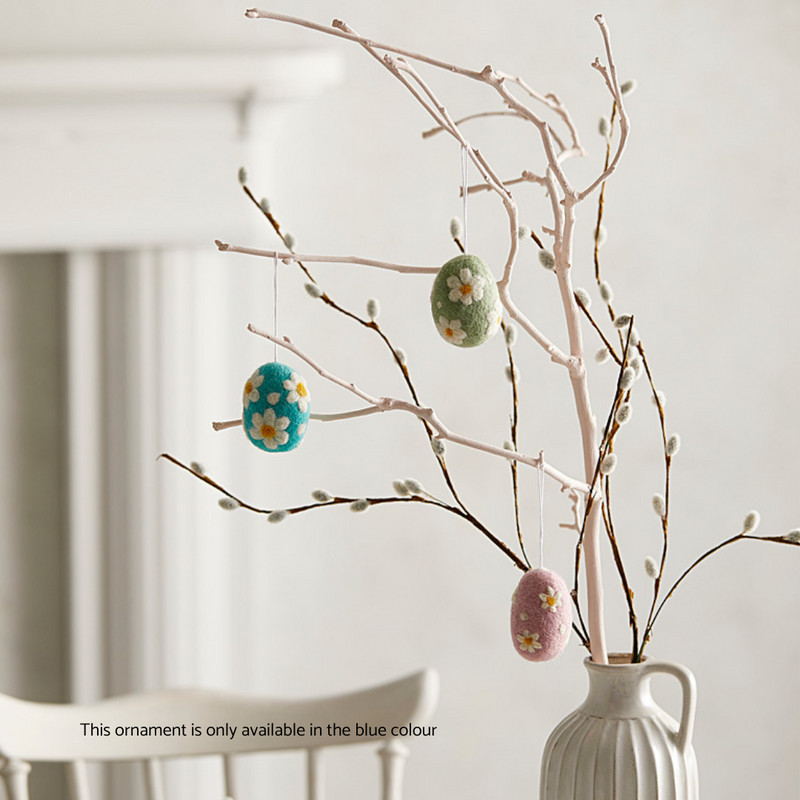 Gingerbread World European Easter Market - Felted wool Hanging Ornament - Blue Easter Eggs with White Flower shown hanging on branches in vase