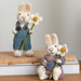 Gingerbread World European Easter Market - White Bunny figures with Marguerite Flowers - lifestyle