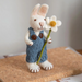 Gingerbread World European Easter Market - White Bunny with Blue Pants and Marguerite - on book