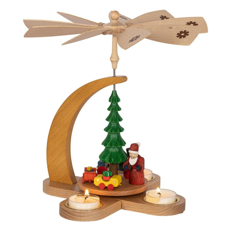 Handcrafted Richard Glässer German Christmas pyramid featuring Santa Claus with a festive Christmas train, made in Seiffen, Germany.