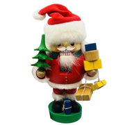Handcrafted Richard Glässer German Santa Claus nutcracker holding wrapped Christmas gifts, made in Seiffen, Germany.