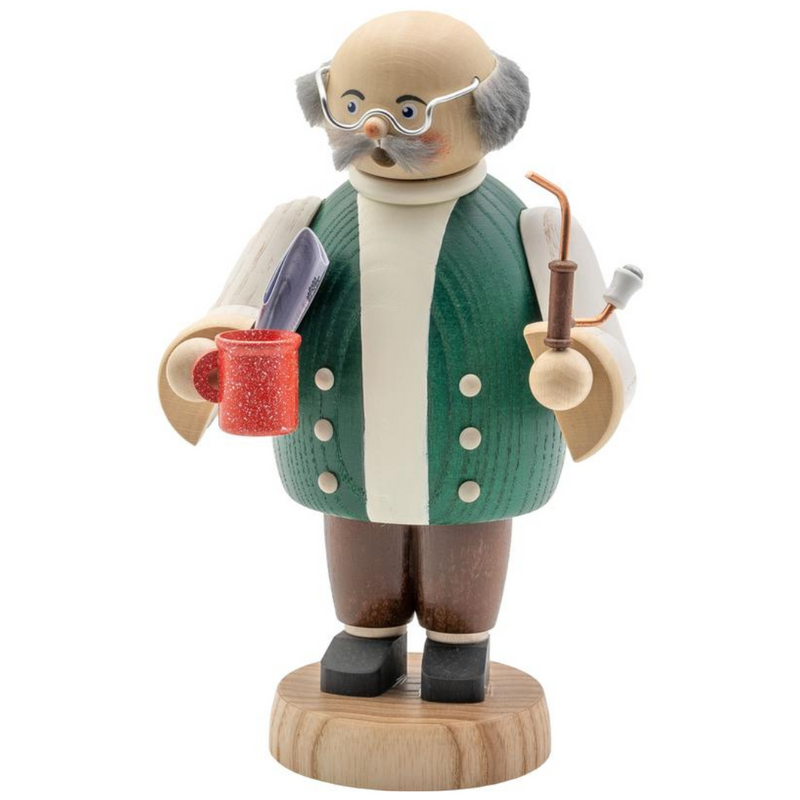 Handcrafted Seiffener Volkskunst Grandfather (Opa) incense smoker holding a coffee mug and newspaper, wearing glasses and a sweater vest, made in Seiffen, Germany.