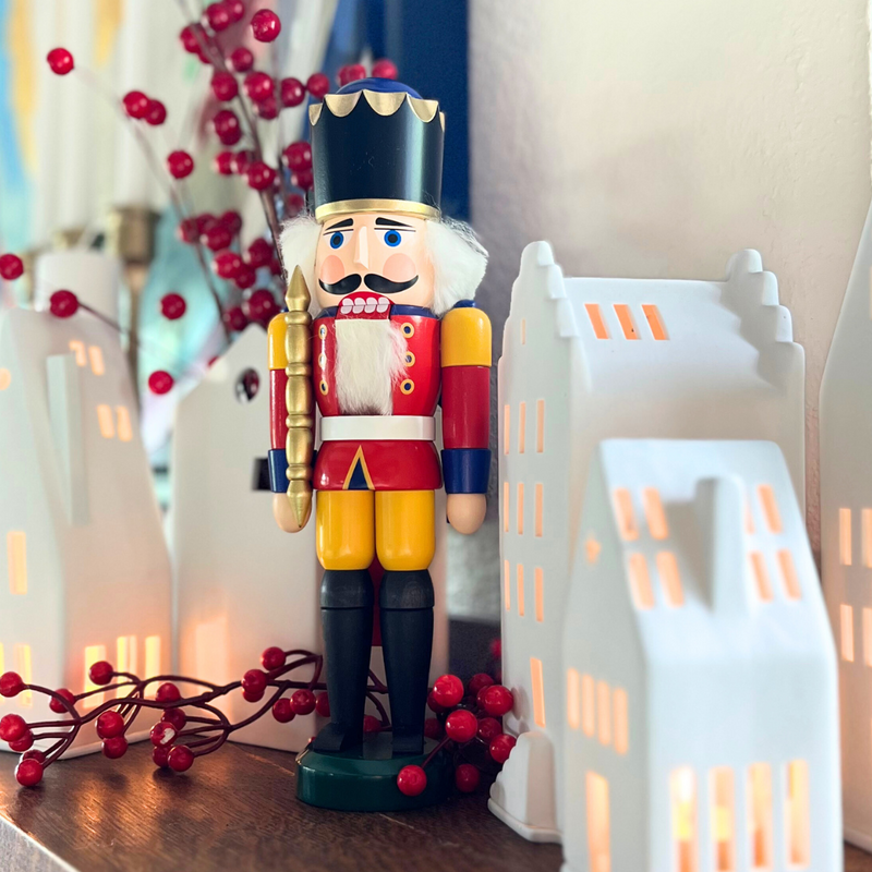 Handcrafted Seiffener Volkskunst Red King German nutcracker with a golden crown, royal sceptre and faux fur beard, 29 cm.