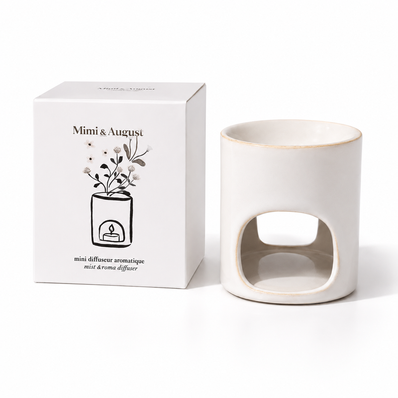 "Mimi & August" Mini Aroma Diffuser ceramic wax melt warmer with retail gift box on a white background.
