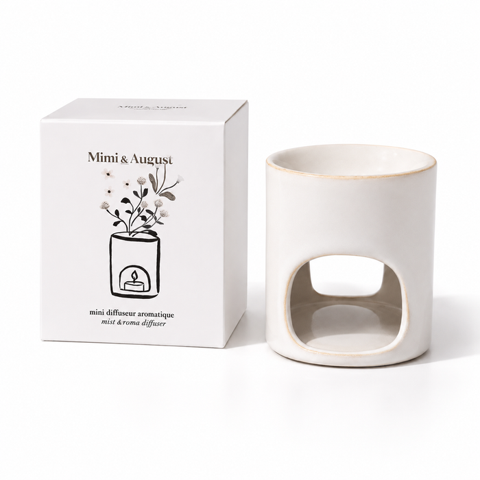 "Mimi & August" Mini Aroma Diffuser ceramic wax melt warmer with retail gift box on a white background.