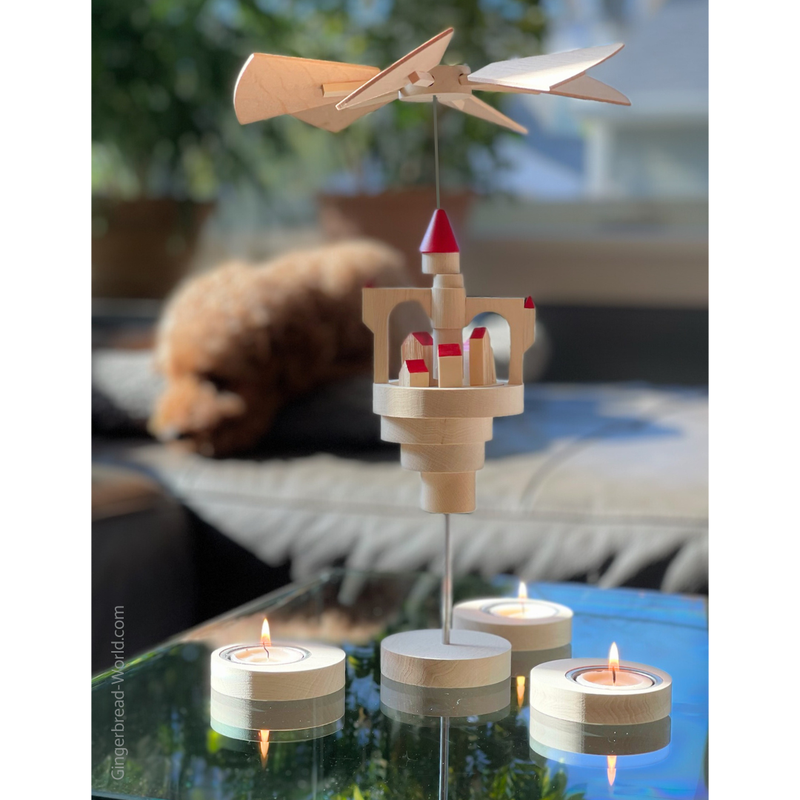 Seiffener Volkskunst Schalling Floating Castle Christmas Pyramid with red roofs, handcrafted in Seiffen, Germany and powered by tealight candles.