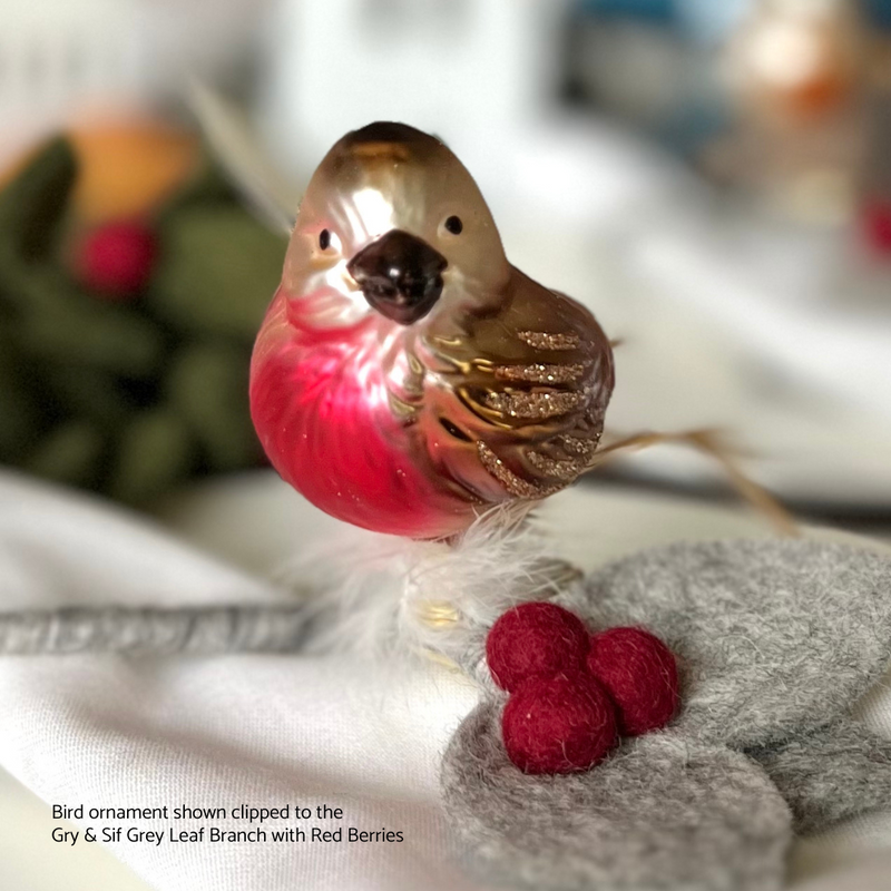 Gingerbread World European Christmas Market - Blown Glass Bird Clip-on ornament shown as a table decoration