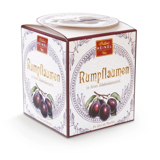 Heindl Rumpflaumen gift cube with individually wrapped dark chocolates filled with whole rum-soaked plums.