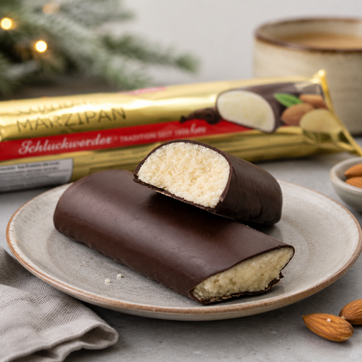 Schluckwerder German marzipan loaf coated in dark chocolate, wrapped in festive red and gold foil, 500 g.