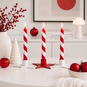 Star-shaped metal taper candle holder in red and white for Advent countdown candles – Gingerbread World European Christmas