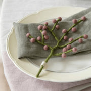 Gingerbread World European Market - En Gry and Sif Felted Wool Forever Flowers – Mini Branch with Rouge Berries 15334 shown on plate and napkin