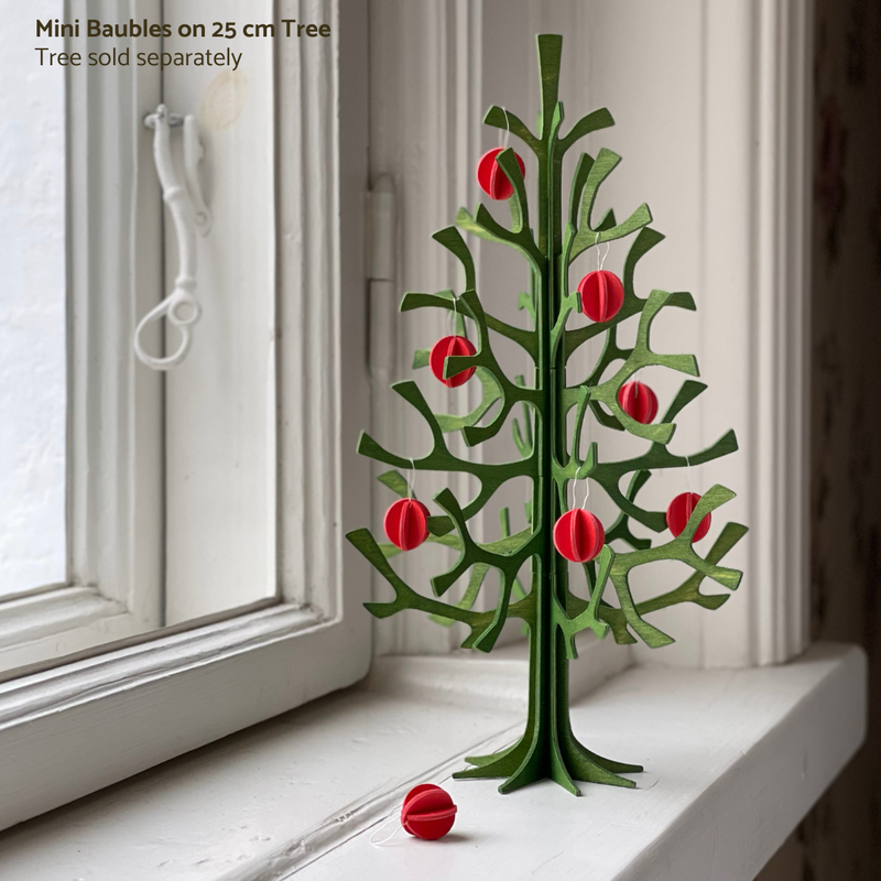 Gingerbread World European Market - Lovi Finland 3D Wooden Puzzle Ornament - Mini Baubles shown on 25 cm Spruce Tree