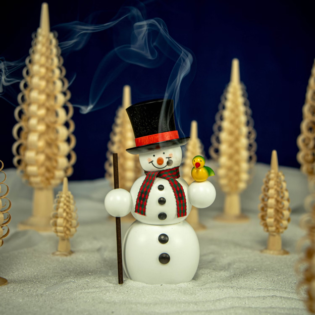 Handcrafted Seiffener Volkskunst Gentleman snowman incense smoker wearing a black top hat, holding a walking stick with a small bird perched on his hand, made in Seiffen, Germany.