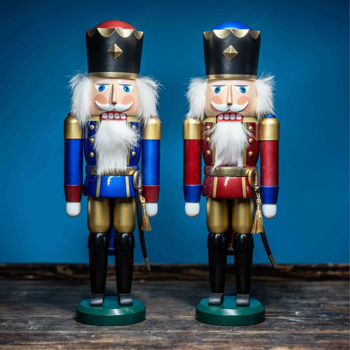 Handcrafted Seiffener Volkskunst King German nutcracker with metallic finish, black crown with gold detailing and metallic top, ceremonial sabre and faux fur beard, 39 cm.