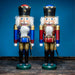Handcrafted Seiffener Volkskunst King German nutcracker with metallic finish, black crown with gold detailing and metallic top, ceremonial sabre and faux fur beard, 39 cm.