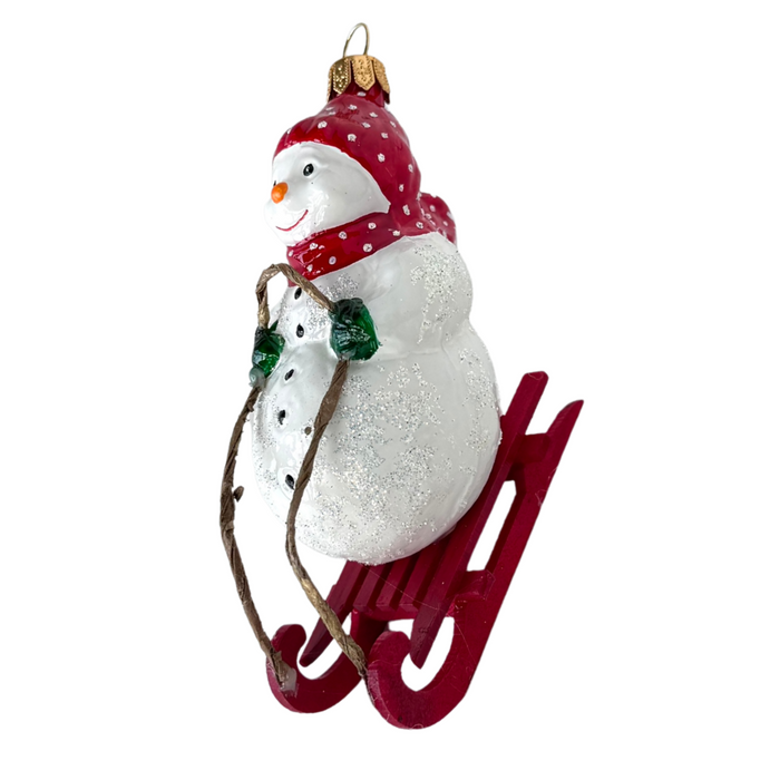 Gingerbread World Polish Blown Glass Ornament – Snowman on Toboggan 162905