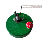 Handcrafted Richard Glässer German toadstool house incense smoker with a red mushroom roof, crooked chimney and ladybug, made in Seiffen, Germany.