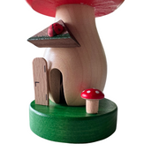 Handcrafted Richard Glässer German toadstool house incense smoker with a red mushroom roof, crooked chimney and ladybug, made in Seiffen, Germany.