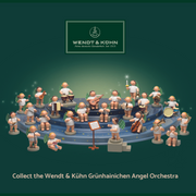 Wendt & Kühn Grünhainichen Angel with Bass Horn handcrafted wooden angel figurine with green wings and eleven white dots, made in Germany  650/46