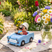 Seiffener Volkskunst limited edition Udo in Trabant German incense smoker displayed on a picnic table outside