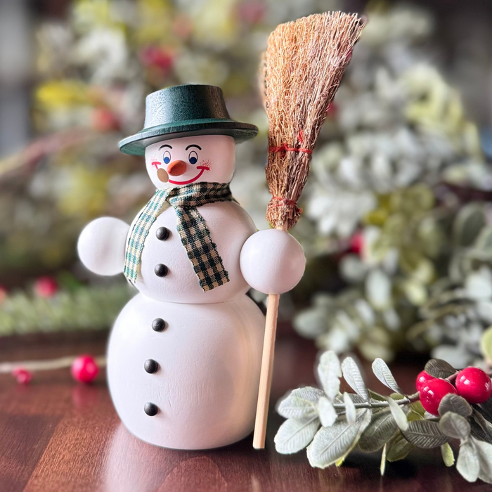 Handcrafted Seiffener Volkskunst Classic snowman incense smoker wearing a black top hat, checked scarf and holding a wooden broom, made in Seiffen, Germany.