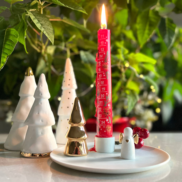 Gingerbread World German Christmas Market - Advent Countdown Candle shown with Raeder Design candle holder and Porcelain Mini Trees