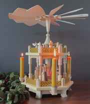 Handcrafted Richard Glässer German two-tier Christmas pyramid featuring the Nativity scene with the Holy Family, angels and Wise Men, made in Seiffen, Germany.