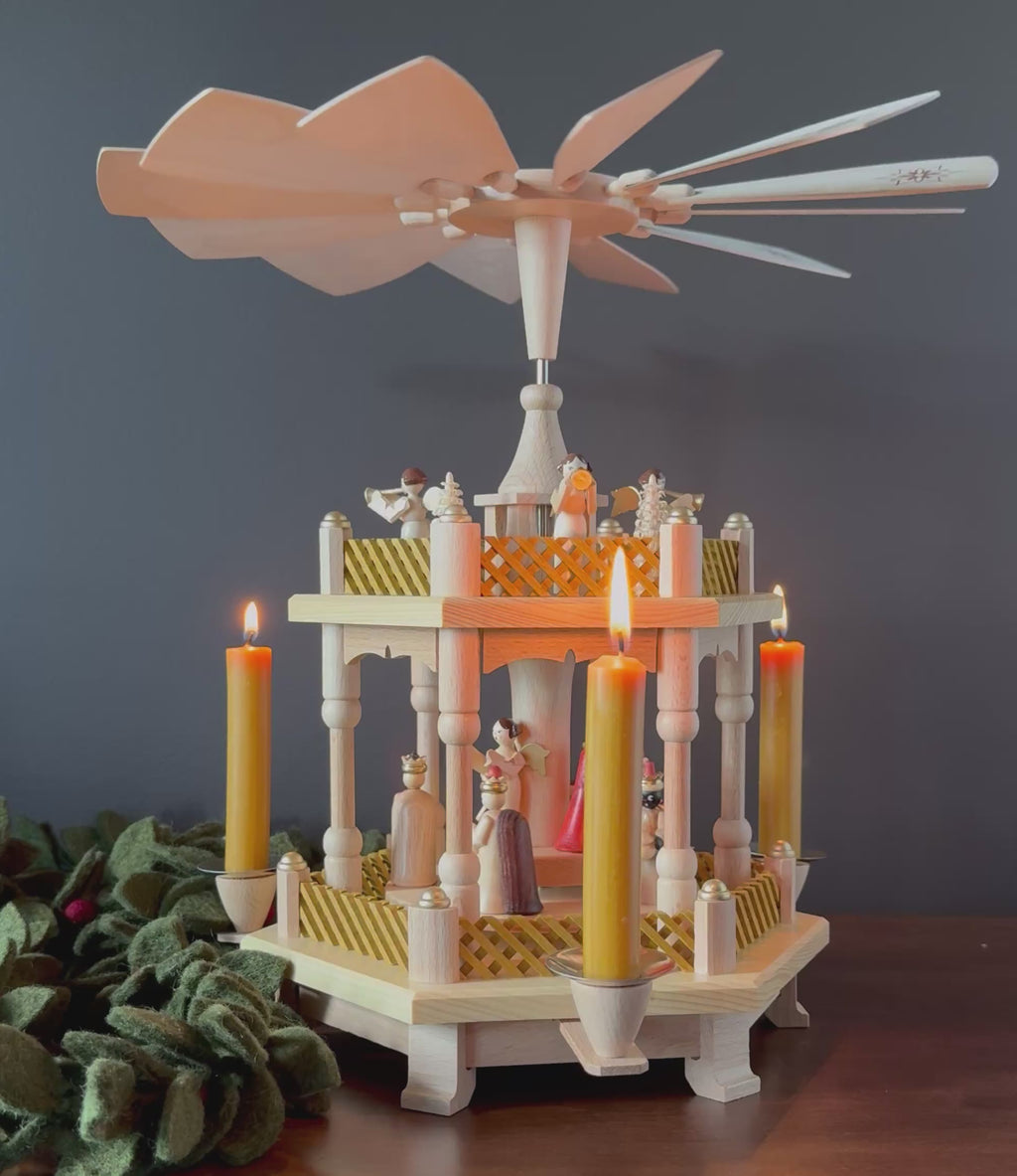 Handcrafted Richard Glässer German two-tier Christmas pyramid featuring the Nativity scene with the Holy Family, angels and Wise Men, made in Seiffen, Germany.