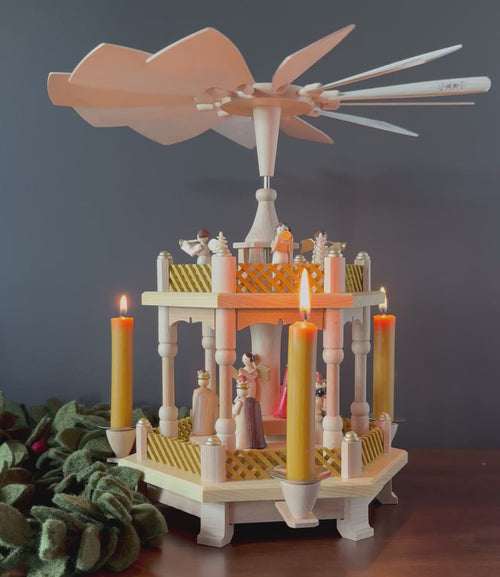 Handcrafted Richard Glässer German two-tier Christmas pyramid featuring the Nativity scene with the Holy Family, angels and Wise Men, made in Seiffen, Germany.