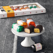 Niederegger Lübeck Marzipan Variations Gift Box with 16 individually wrapped assorted mini marzipan loaves coated in dark chocolate.