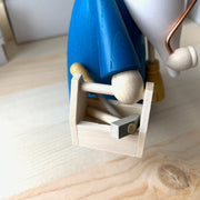 Handcrafted Seiffener Volkskunst Handyman Gnome incense smoker with a brown hat, blue coat, miniature toolbox and broom, made in Seiffen, Germany.