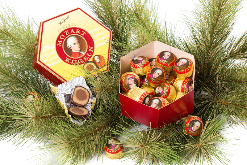 Victor Schmidt Mozart Kugeln gift box with 18 authentic Austrian Mozart Balls made with marzipan, hazelnut nougat and chocolate.