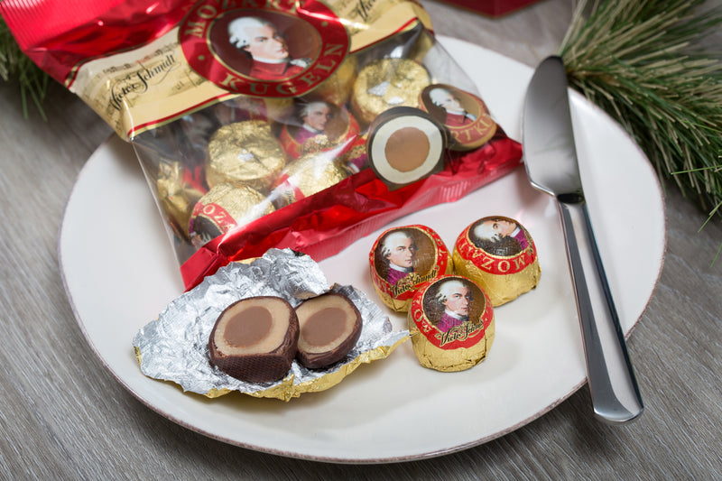 Authentic Austrian Victor Schmidt Mozart Kugeln with layers of marzipan, hazelnut nougat and chocolate. Convenient 9-piece cello bag.