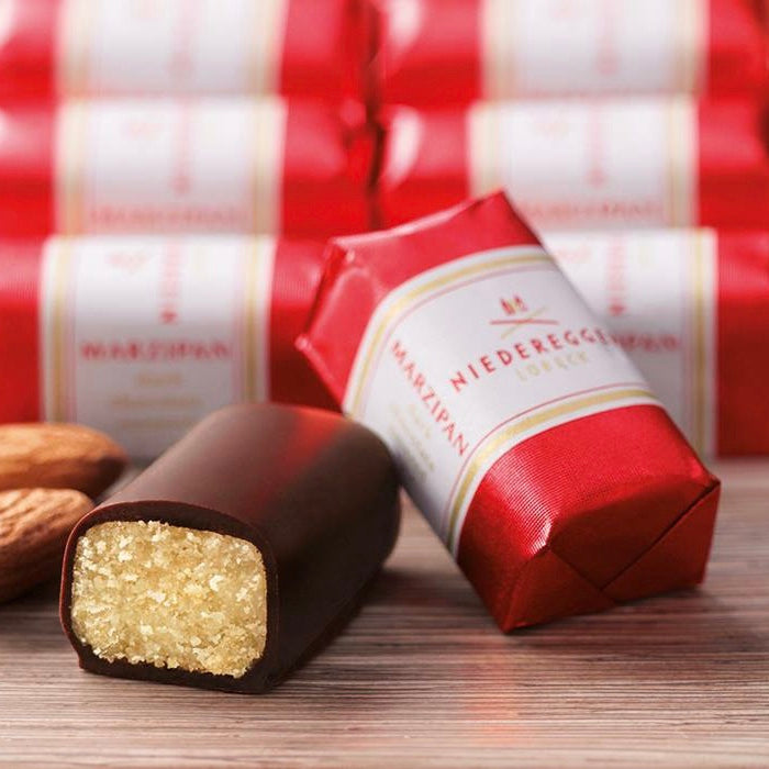 Niederegger Lübeck Marzipan Classics Gift Box with 16 individually wrapped mini marzipan loaves in dark chocolate.