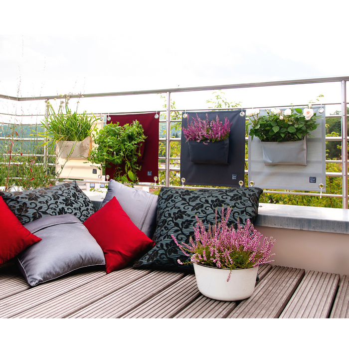 Blooming Walls Canada The Green Pockets Hanging Planters on balcony railings with outdoor cushions