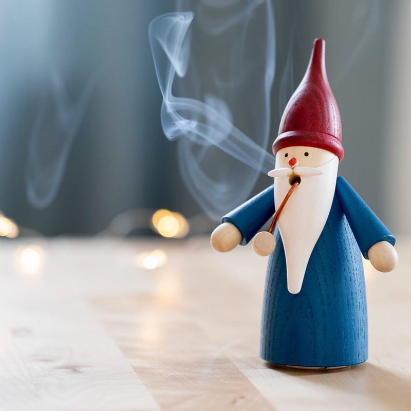 Handcrafted Seiffener Volkskunst Blue Gnome incense smoker with a blue coat, red hat and white beard, made in Seiffen, Germany.
