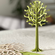 Gingerbread World European Market - Lovi Wooden Creations from the Forests of Finland - 3D wooden Tree 16.5 cm - pale green on table shpwing assembly