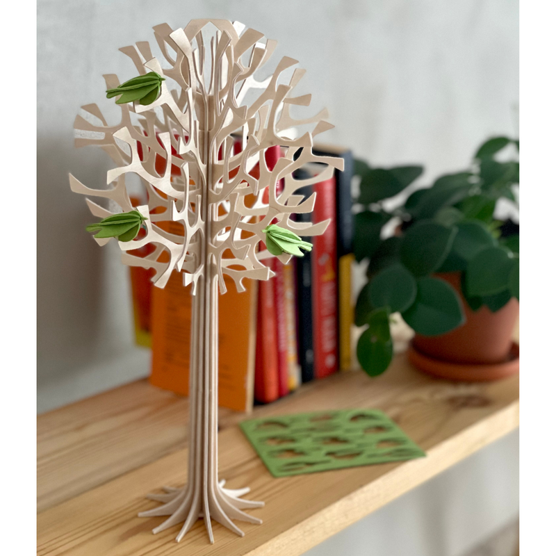 Gingerbread World European Market - Lovi Wooden Creations from the Forests of Finland - 3D wooden Tree with light Green Mini Birds 34 cm shown on bookshelf