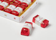 Niederegger Lübeck Marzipan Classics Gift Box with 16 individually wrapped mini marzipan loaves in dark chocolate.