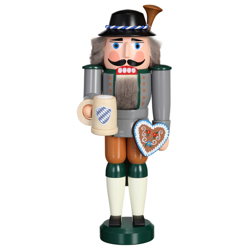 Handcrafted Seiffener Volkskunst Bavarian German nutcracker wearing traditional Tracht and holding a beer stein and heart-shaped Lebkuchen.